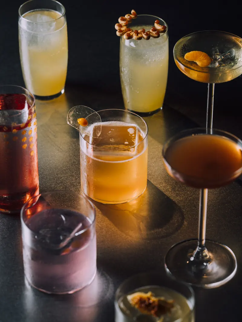 Signature cocktails lined up on the bar at SEDE