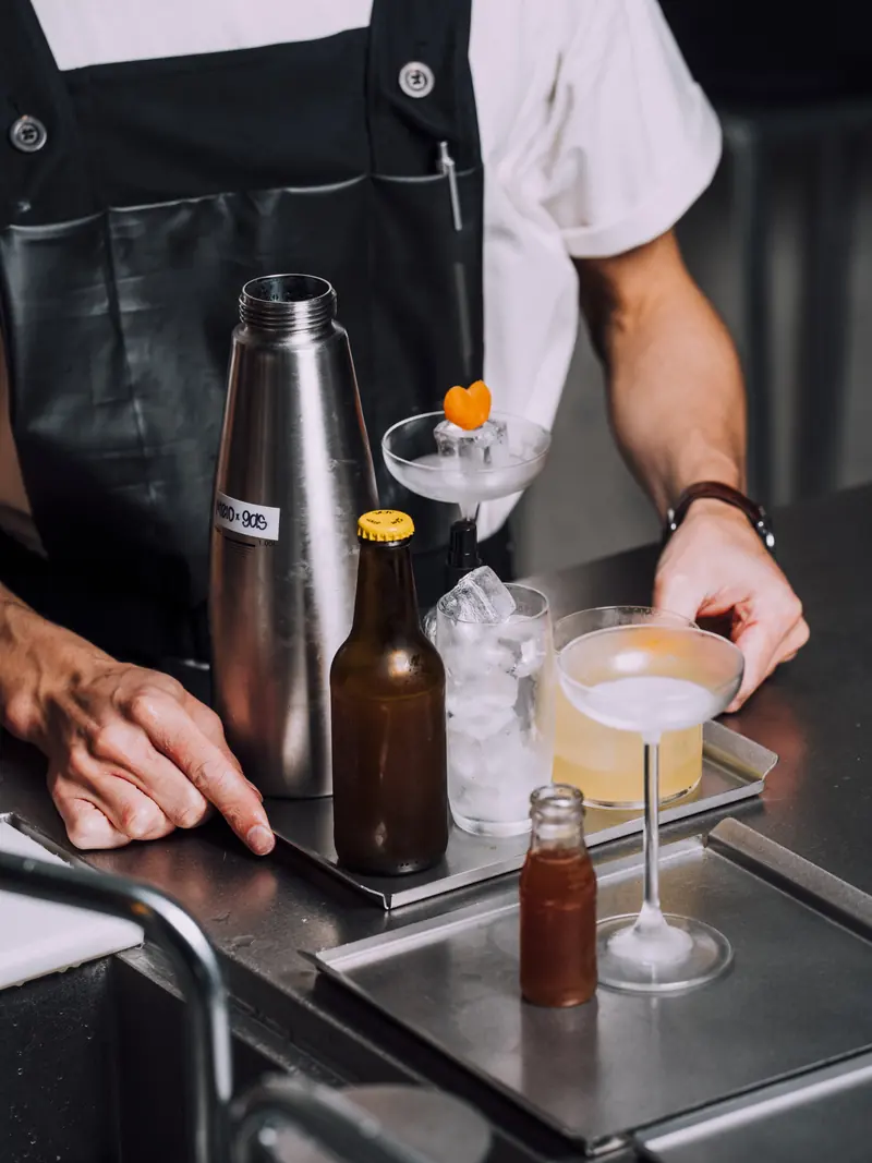 Bartender making a cocktail behind the bar at SEDE